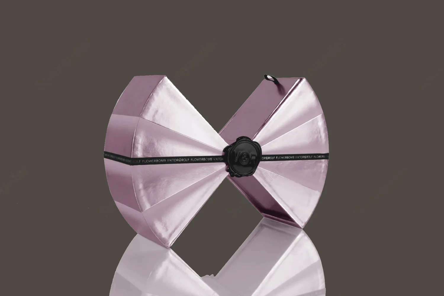 A paper box in the shape of a bow tie with a drawer box structure